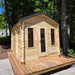 Wooden cabin with a deck in a forest setting