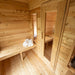 Wooden sauna with benches and towels inside